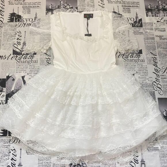 Dolls Kill Dresses & Skirts - Dollskill Delias Women's White lace babydoll princess dress tiered miniskirt nwt